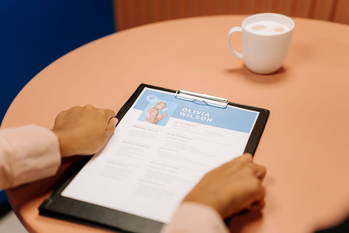 Person holding black tablet computer